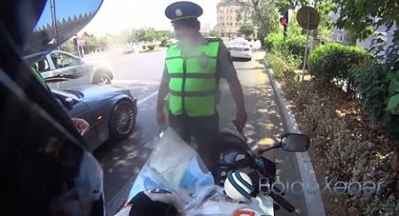 Bakıda bayker yol polisini qanunla haqsız çıxardı (VİDEO)