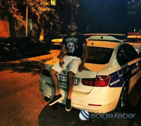Bakıda polis maşınının üzərində pivə içən şəxs saxlanıldı